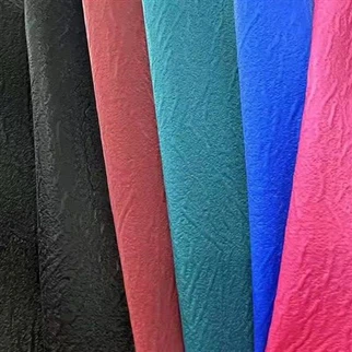 Arrugas coloridas Fabricación de terciopelo con textura PU Tela de cuero sintético para tapicería para equipos de equipaje